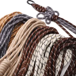 Detailed close-up of earth-toned braided polyester cords with decorative hand-woven knots