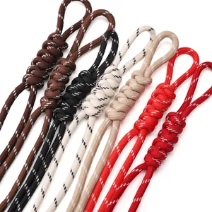 Close-up of multicolored braided polyester cords with spiral knots for DIY jewelry making