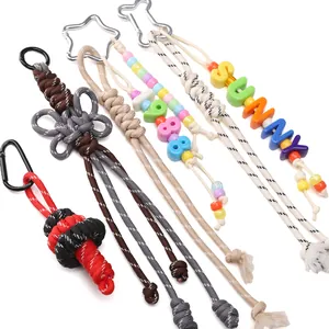 Handmade paracord keychains with colorful beads and metal carabiners in various weaves
