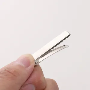 Macro shot of silver metal alligator hair clips with serrated edges for DIY crafts