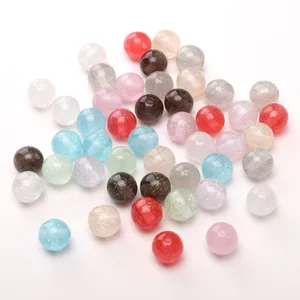 Macro detail of colorful glitter resin beads with pre-drilled holes for DIY jewelry