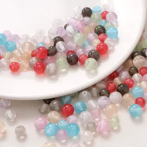 Macro shot of colorful resin round beads with glitter sand texture for DIY jewelry making