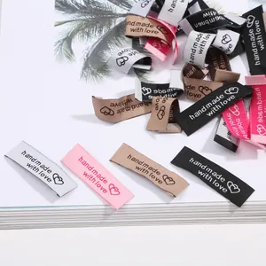 Set of colorful handmade with love fabric garment labels for DIY sewing crafts