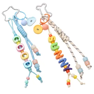 Colorful macaron resin smiley face keychains with woven beads and star-shaped metal clasps