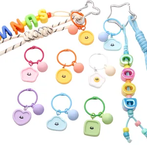 Colorful Macaron resin smiley face keychains with assorted shapes and alphabet beads