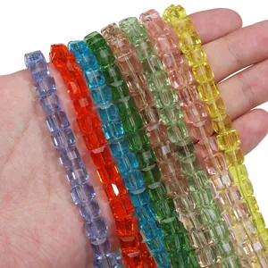 Macro detail of faceted cube glass beads in seven colors for DIY jewelry making