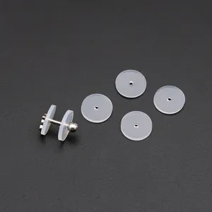 Macro detail of transparent silicone earring pads and stainless steel ball stud set