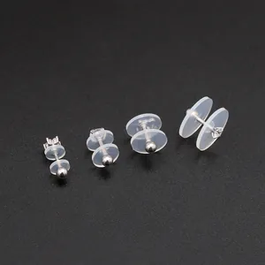 Macro detail of transparent silicone earring pads and silver stainless steel studs