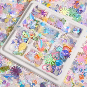 Paillettes irisées mixtes en formes de fleurs et d'étoiles avec plateau blanc