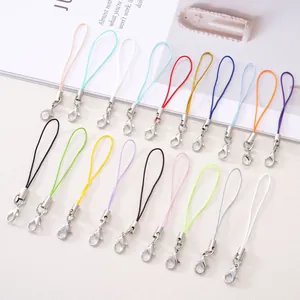 Close-up of colorful polyester braided lanyards with metal lobster clasps for DIY crafts