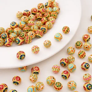 Macro view of gold-plated alloy enamel beads with Chinese characters for DIY jewelry