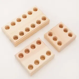 Top view of solid wood tool holder racks for pliers with organized cylindrical slots