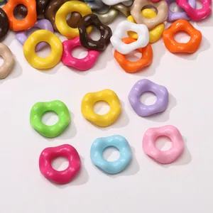 Macro detail of assorted wave-shaped acrylic spacer beads for DIY jewelry making