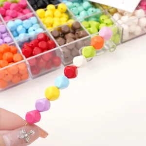 Close-up of colorful acrylic square beads on a string for DIY jewelry making