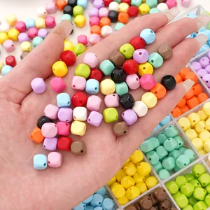 Close-up of colorful acrylic square beads for DIY jewelry making in various macaron colors