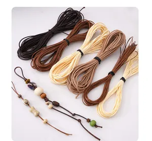 Detail view of waxed cord threads for DIY jewelry making in various earthy brown tones