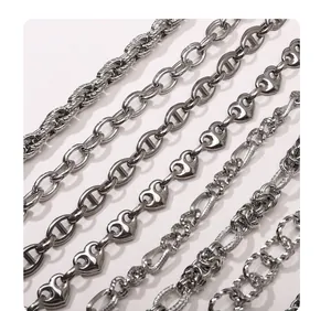 Selection of silver stainless steel chains including curb, link, and figaro styles for DIY