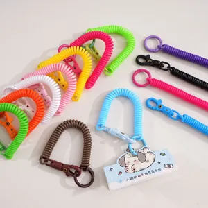 Close-up of colorful spiral spring keychains with plastic carabiners for DIY crafts