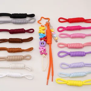 Colorful hand-woven paracord keychains with star clips and personalized letter beads