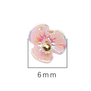 Macro detail of a 6mm resin lily of the valley flower charm with iridescent petals