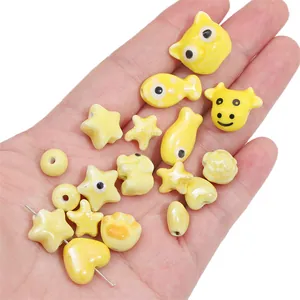 Gele keramische cartoon kralen voor DIY sieraden met ster- en vismotieven