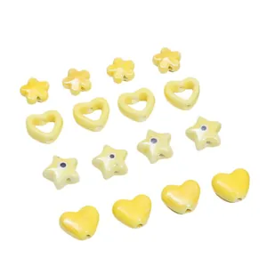 Yellow ceramic beads set with heart and star shapes for DIY necklace and bracelet jewelry