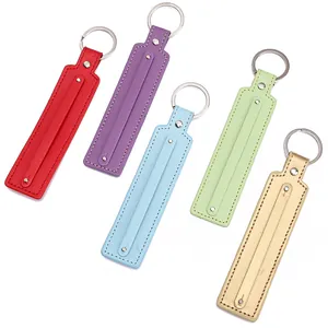 Handmade leather keychains in five colors with silver rings on white background