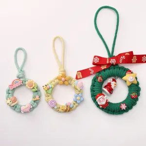 Hand-woven cotton rope craft rings with colorful flower and Christmas themed decorations