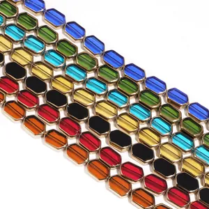 Macro detail of multicolored faceted glass beads with gold metal edges for DIY jewelry
