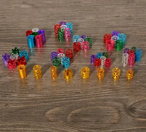 Macro detail of various colorful aluminum crown beads and textured hair accessories