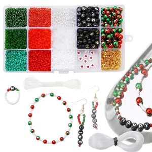 Christmas DIY jewelry kit with red and green glass beads, letter charms and tools in a box