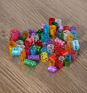 Macro detail of adjustable aluminum crown hair rings in various vibrant metallic colors