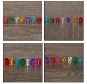 Macro view of assorted colorful crown aluminum dreadlock beads with hollow patterns