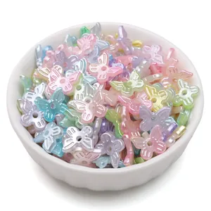 Macaron butterfly ABS pearl beads for DIY jewelry making displayed in a white bowl