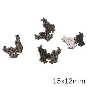 Macro view of gothic silver butterfly spacer beads with ornate Baroque engravings
