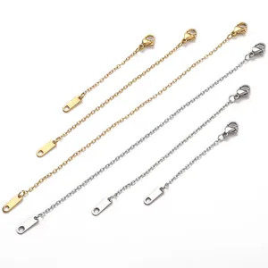 Close-up of gold and silver stainless steel extender chains with lobster clasps