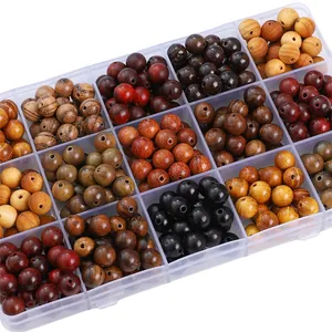 Detailed view of sorted natural wood beads in a multi-grid plastic organizer box