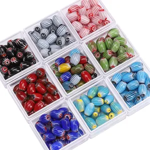Detailed top view of nine grid boxes with colorful oval millefiori glass beads for DIY