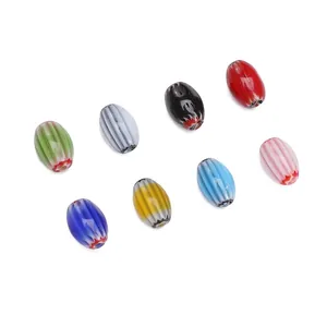Detail of oval millefiori glass beads with white stripes for DIY jewelry making
