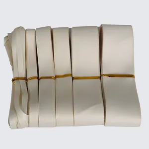 Cream grosgrain ribbon rolls in multiple widths for DIY crafts and gift wrapping