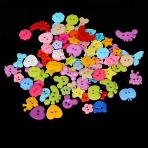 Assorted colorful plastic buttons in shapes of hearts, stars and flowers for DIY crafts