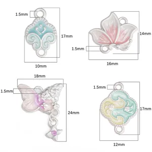 Detailed view of colorful pastel enamel alloy flower and butterfly pendants for DIY jewelry