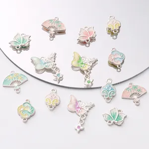 Detailed macro view of enamel Chinese style butterfly and lotus charms for DIY jewelry making