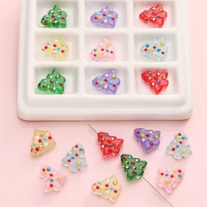Macro shot of colorful hand-painted glass Christmas tree beads for DIY jewelry making
