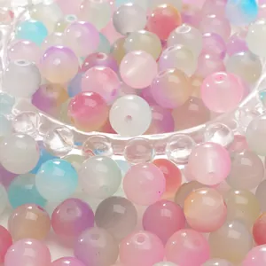 Frosted gradient macaron glass beads for DIY jewelry making in a transparent bowl