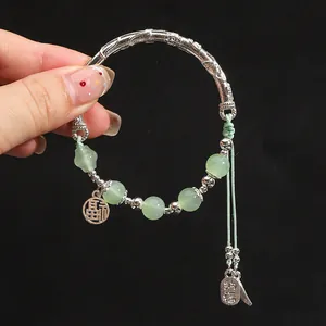 Bamboo style silver bangle with green jade beads and Chinese Fu character charm