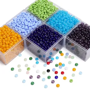 Macro detail of colorful 6x3mm jelly glass beads in transparent storage containers