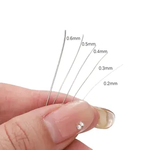 Détail de cinq tailles de fil métallique argenté de 0,2 mm à 0,6 mm pour la création de bijoux