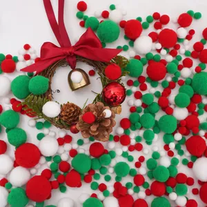 Detail of Christmas wreath with red bow, pine cones, and festive plush pompoms background