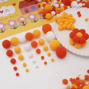 Kit de bricolage avec pompons en peluche orange, blanc et jaune pour projets créatifs